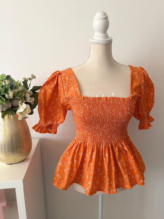 Top floral naranja