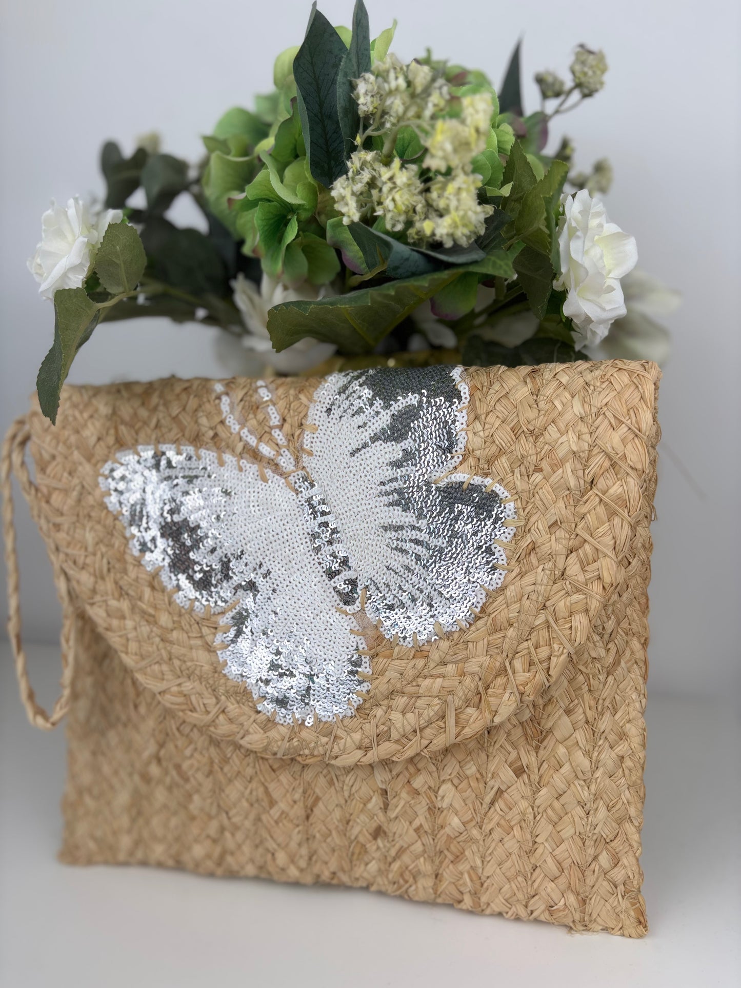 Bolso mariposa blanco y plata