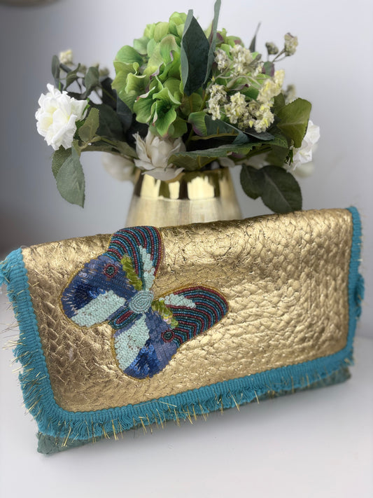 Bolso mariposa dorado y turquesa
